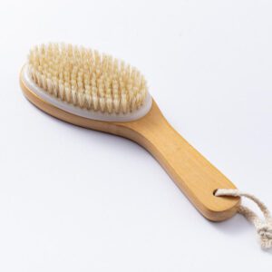 A natural wood brush with soft bristles, designed for gentle exfoliation and improving skin health.