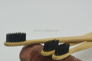 eco friend bamboo charcoal toothbrush using  bamboo holder