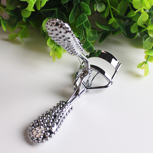 Gold diamond handle eyelash curler