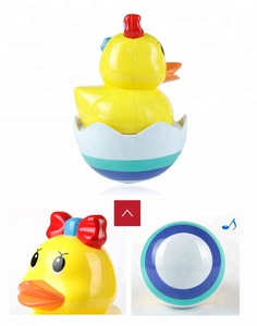 Plastic yellow duck bath baby tumbler roly poly toy for wholesale
