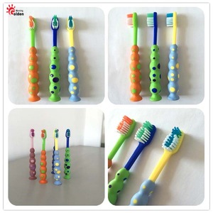 Soft TPE handle children toothbrush with suction cup