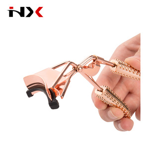 Rose Gold Color Heated Eyelash Curler with Acupressure Style Massage Plastic Handle
