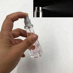 Unique pump sprayer glass perfume bottles 15ml with hat cap