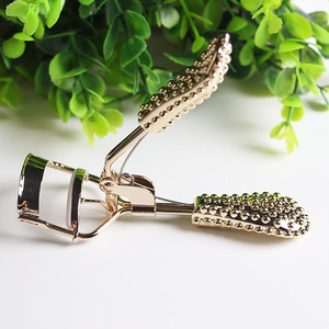 Gold diamond handle eyelash curler